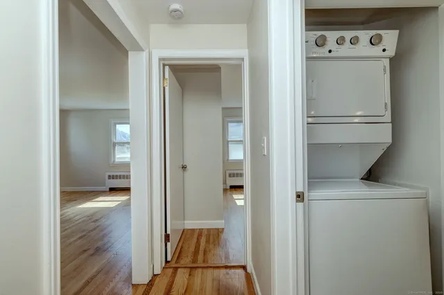 a view of hallway with wooden floor