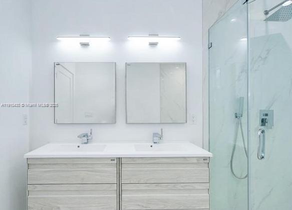 3024 Southwest 16th Terrace, Unit 3024 Miami, FL 33145 - Photo 14 of 16 a bathroom with a sink and a mirror