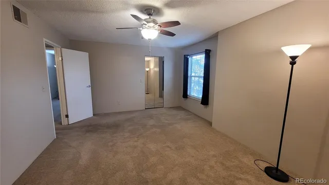 a kitchen with stainless steel appliances granite countertop a refrigerator a stove top oven a sink and dishwasher