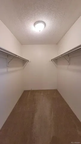 a kitchen with granite countertop a stove microwave and sink