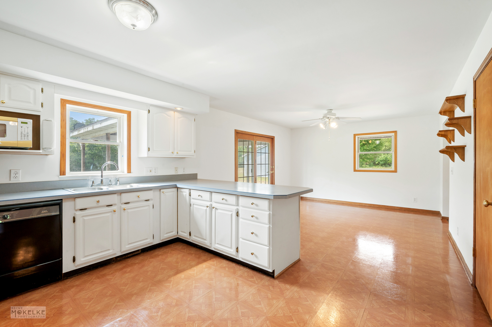 8124 A Finnie Road Newark, IL 60541 - Photo 12 of 33 a large kitchen with granite countertop a stove a sink and a microwave