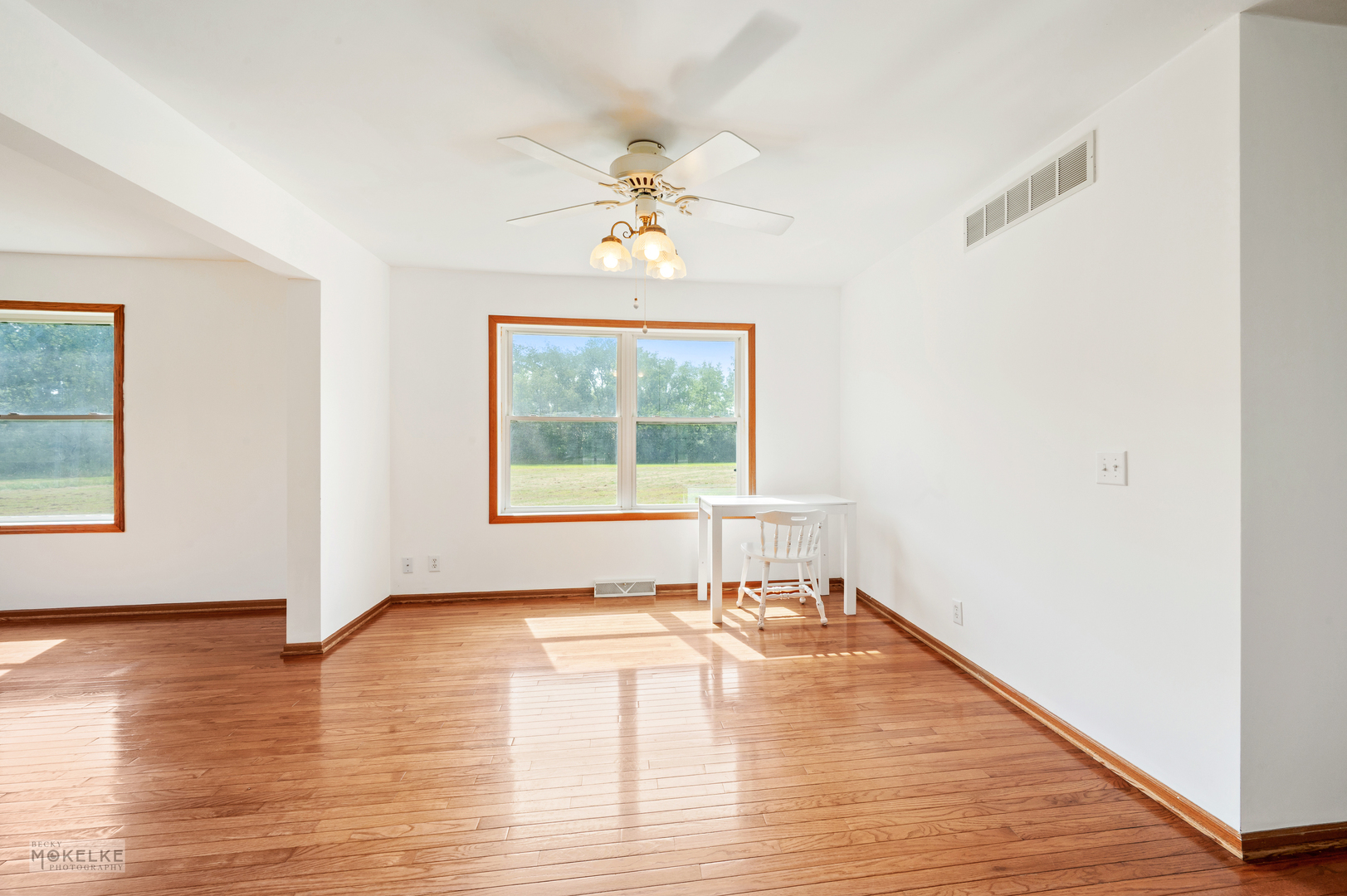 8124 A Finnie Road Newark, IL 60541 - Photo 17 of 33 a view of empty room with wooden floor and fan