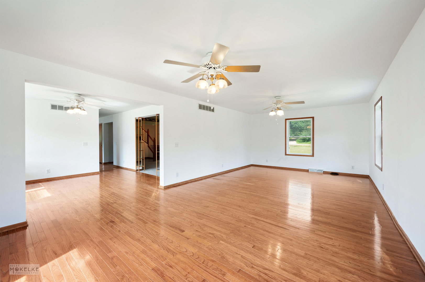 8124 A Finnie Road Newark, IL 60541 - Photo 18 of 33 a view of an empty room with window and wooden floor