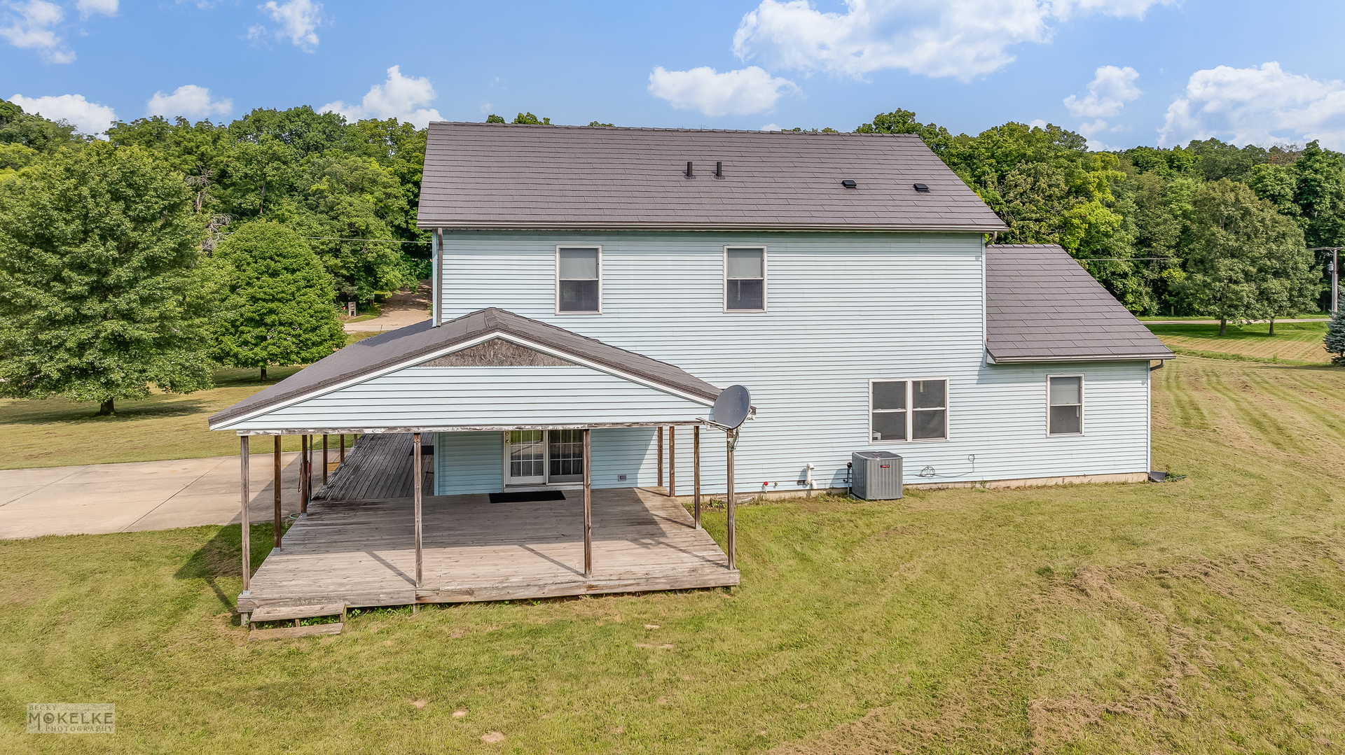 8124 A Finnie Road Newark, IL 60541 - Photo 29 of 33 a front view of a house with a yard and potted plants