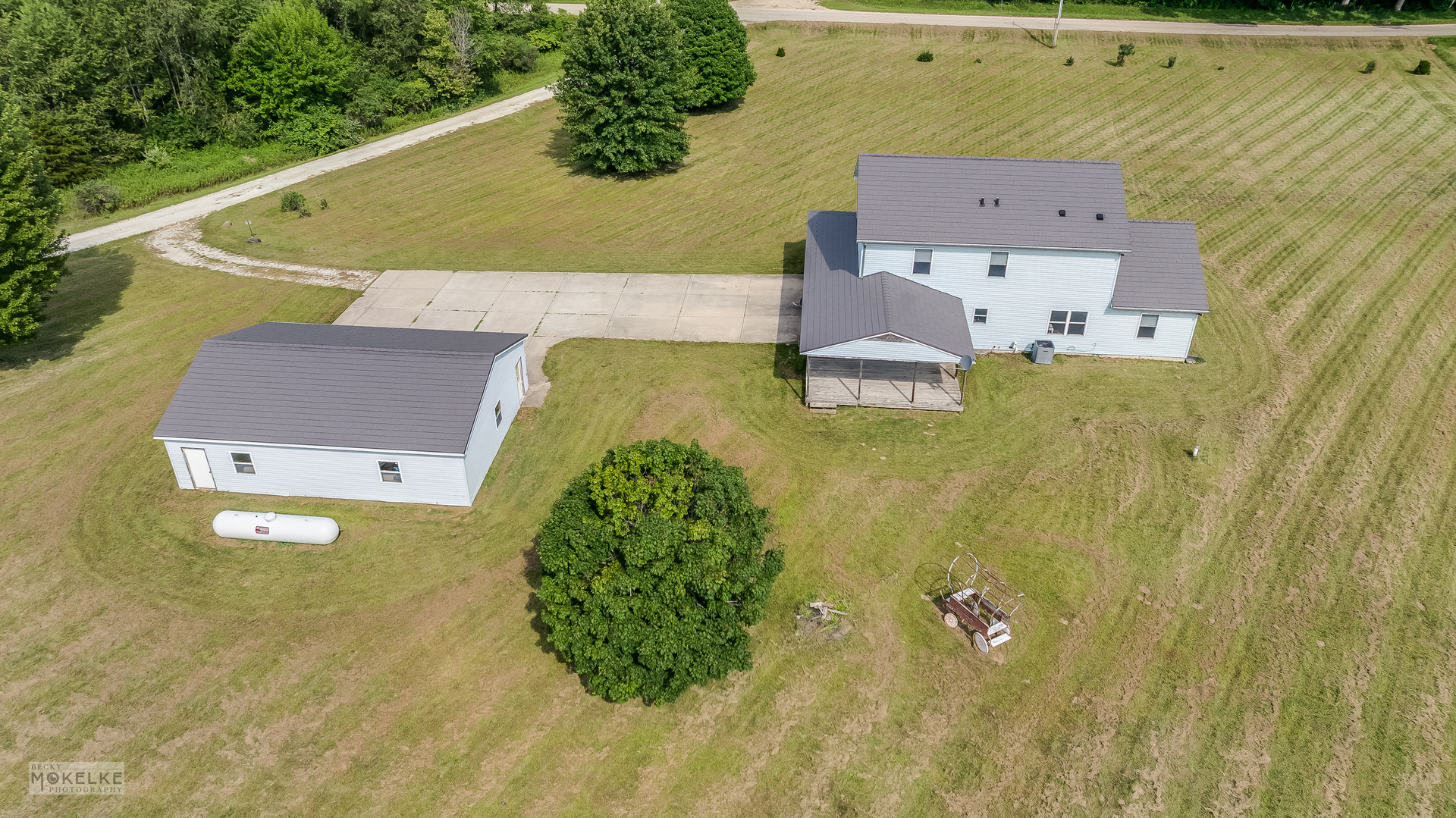 8124 A Finnie Road Newark, IL 60541 - Photo 5 of 33 an aerial view of a residential houses with outdoor space and swimming pool