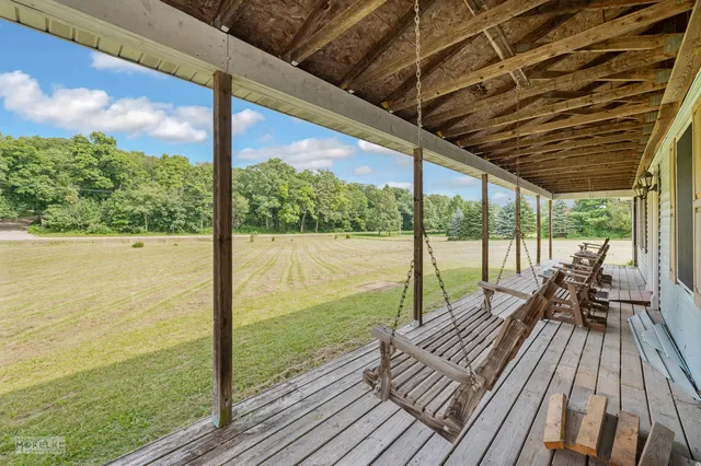 a view of balcony with wooden floor