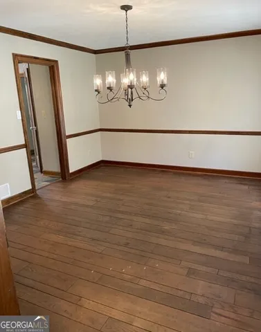 a view of a livingroom with wooden floor