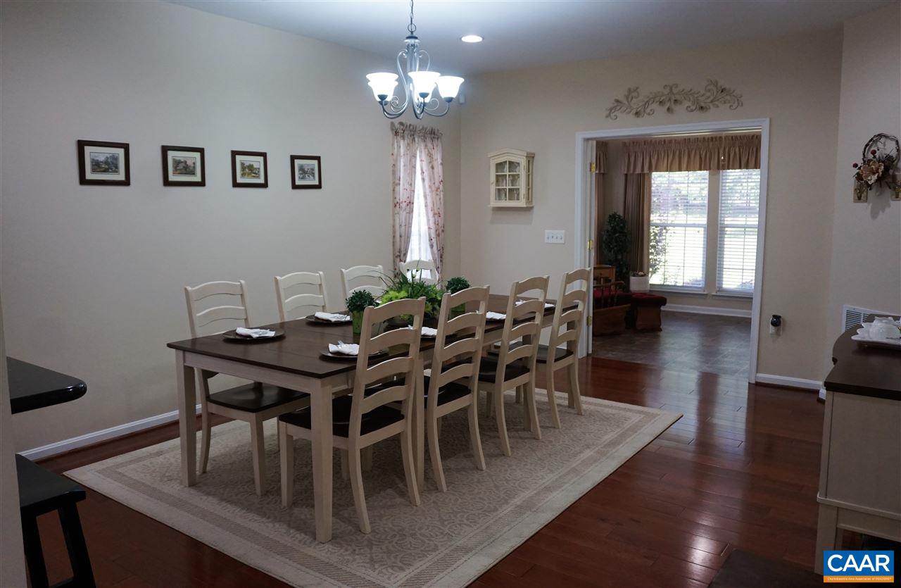 149 John Rucker Drive Ruckersville, VA 22968 - Photo 11 of 32 The Kitchen opens to this large Dining Room, and the Sun Room.