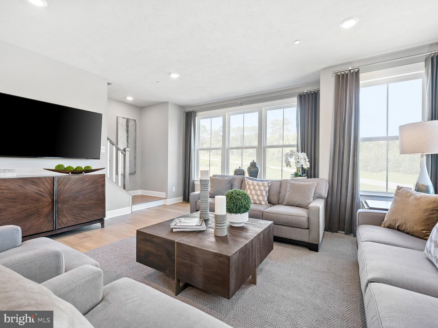 1765 Mill Branch Drive Laurel, MD 20708 - Photo 3 of 12 a living room with furniture and a flat screen tv