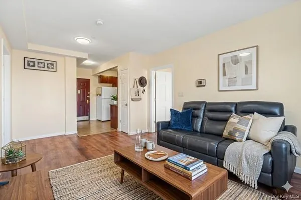 a kitchen with stainless steel appliances granite countertop a refrigerator sink and stove