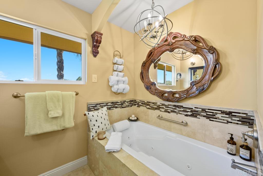 1131 Rainbow Valley Boulevard Fallbrook, CA 92028 - Photo 16 of 73 a bathroom with a sink and a mirror