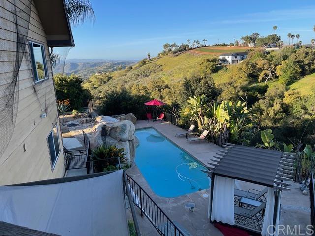 1131 Rainbow Valley Boulevard Fallbrook, CA 92028 - Photo 29 of 73 a view of a balcony with an outdoor seating