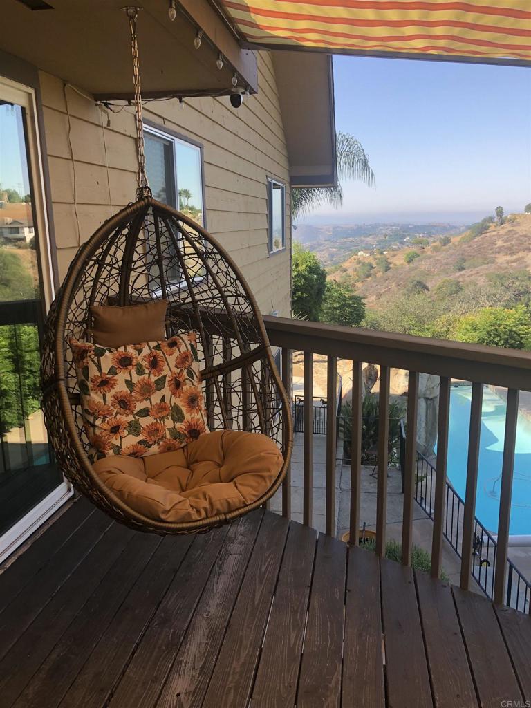 1131 Rainbow Valley Boulevard Fallbrook, CA 92028 - Photo 31 of 73 a view of a balcony with wooden floor