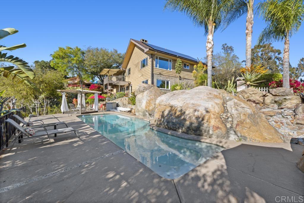 1131 Rainbow Valley Boulevard Fallbrook, CA 92028 - Photo 39 of 73 a front view of a house with a yard and garage