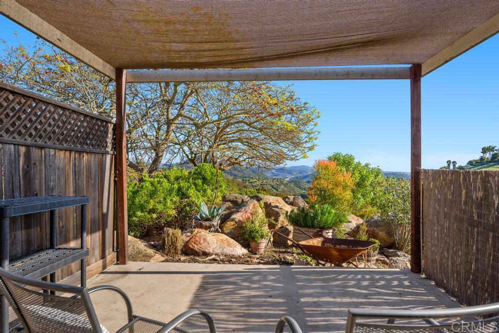 1131 Rainbow Valley Boulevard Fallbrook, CA 92028 - Photo 49 of 73 a view of a porch with a chairs and table in the patio