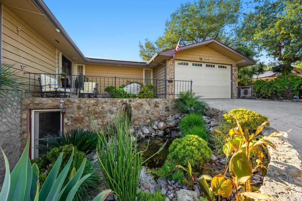 1131 Rainbow Valley Boulevard Fallbrook, CA 92028 - Photo 50 of 73 a bathroom with a sink and mirror