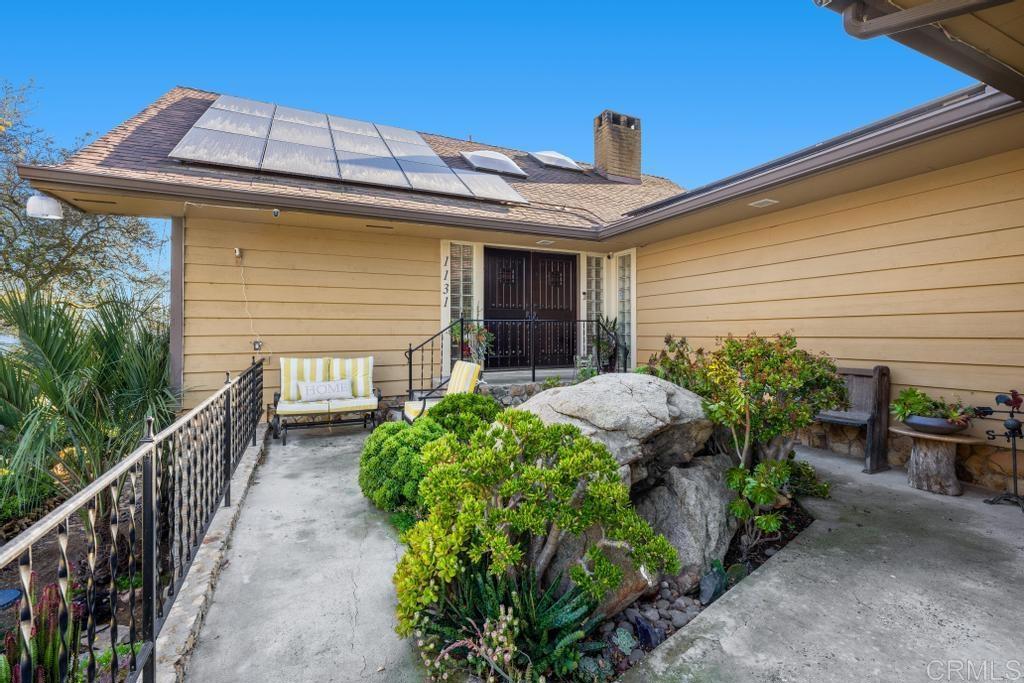 1131 Rainbow Valley Boulevard Fallbrook, CA 92028 - Photo 51 of 73 a front view of a house with garden