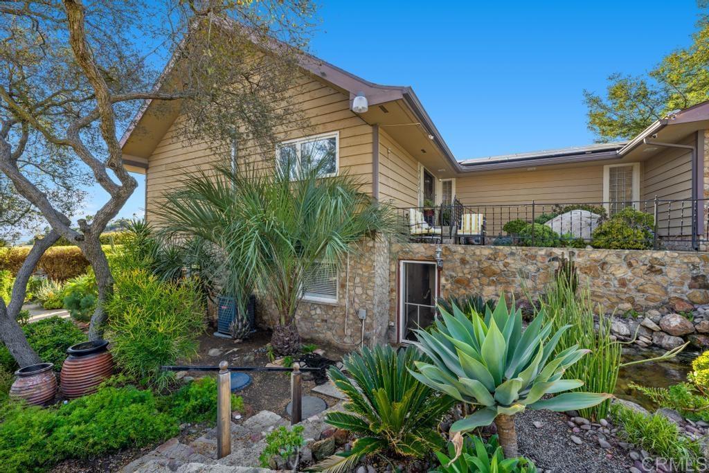 1131 Rainbow Valley Boulevard Fallbrook, CA 92028 - Photo 65 of 73 a backyard of a house with lots of green space