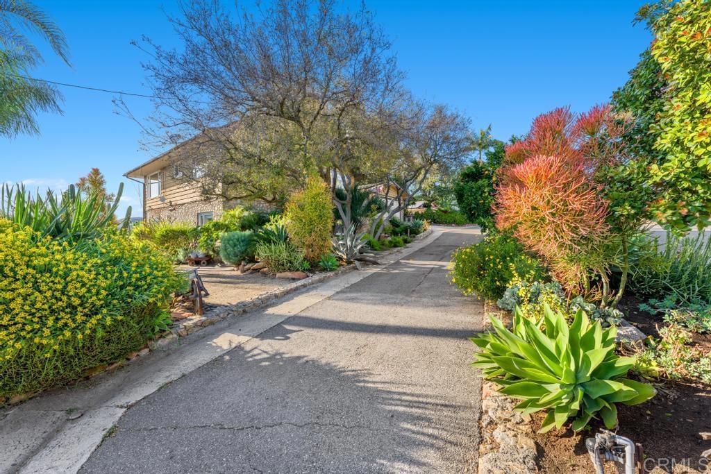 1131 Rainbow Valley Boulevard Fallbrook, CA 92028 - Photo 69 of 73 a plant is in front of a house
