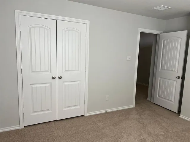 an empty room with a door