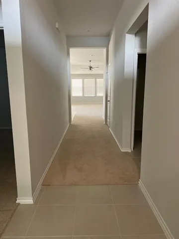a view of a refrigerator in a kitchen