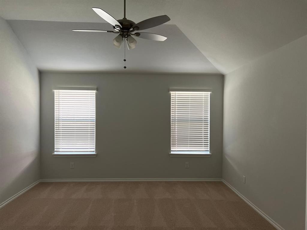 1809 Osage Trail Mesquite, TX 75149 - Photo 7 of 18 an empty room with windows and fan