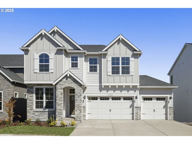 a view of a house and a yard