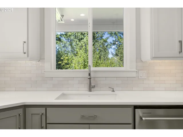 a view of staircase with railing and white walls