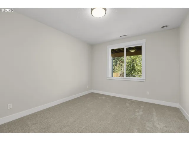 a bathroom with a shower and a sink