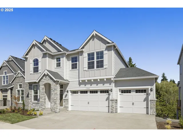 a view of a white house with a large windows