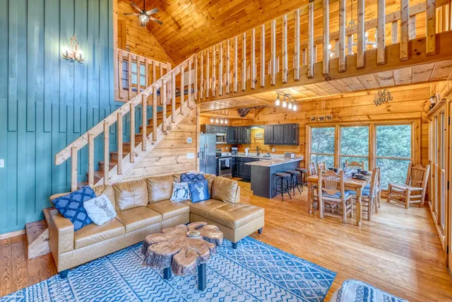 a living room with fireplace furniture and a fireplace