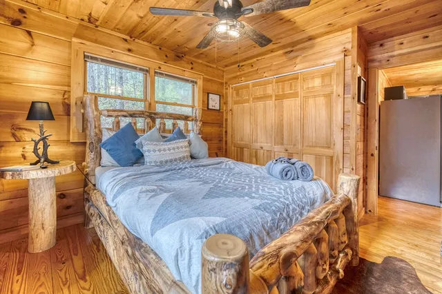 a view of a balcony with wooden floor and fence