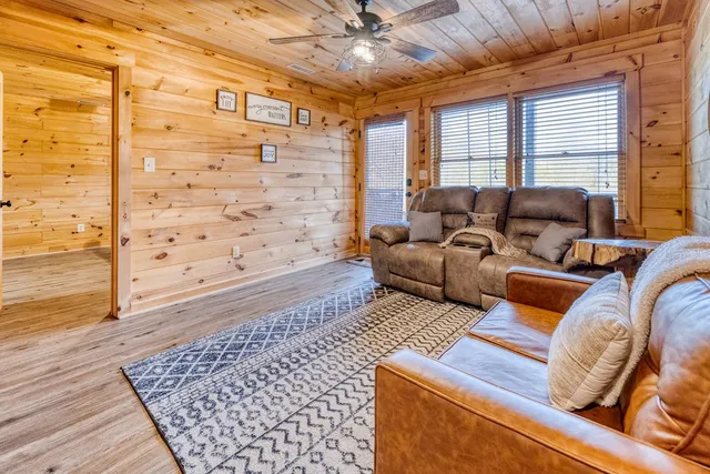 a view of a wooden chairs with a table and chair