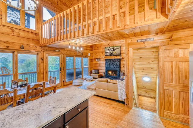 a kitchen with kitchen island granite countertop wooden cabinets a sink and dishwasher