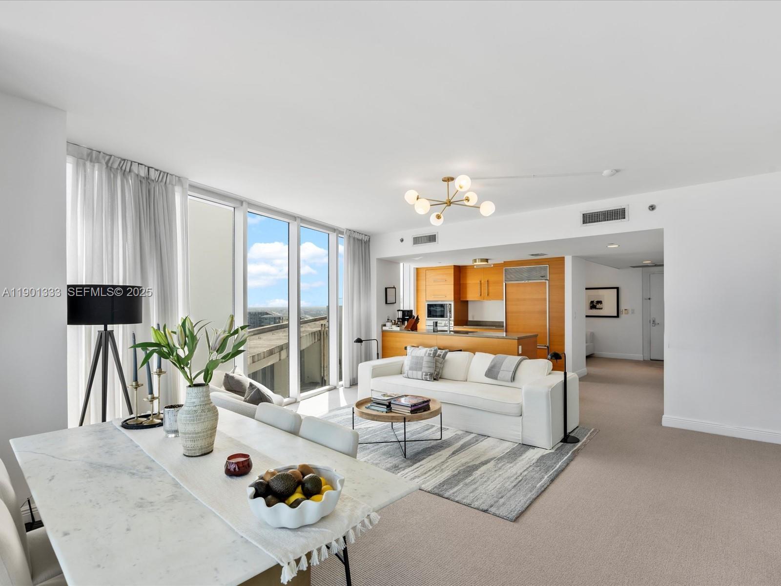 475 Brickell Avenue, Unit 5507 Miami, FL 33131 - Photo 10 of 21 a living room with furniture and a large window