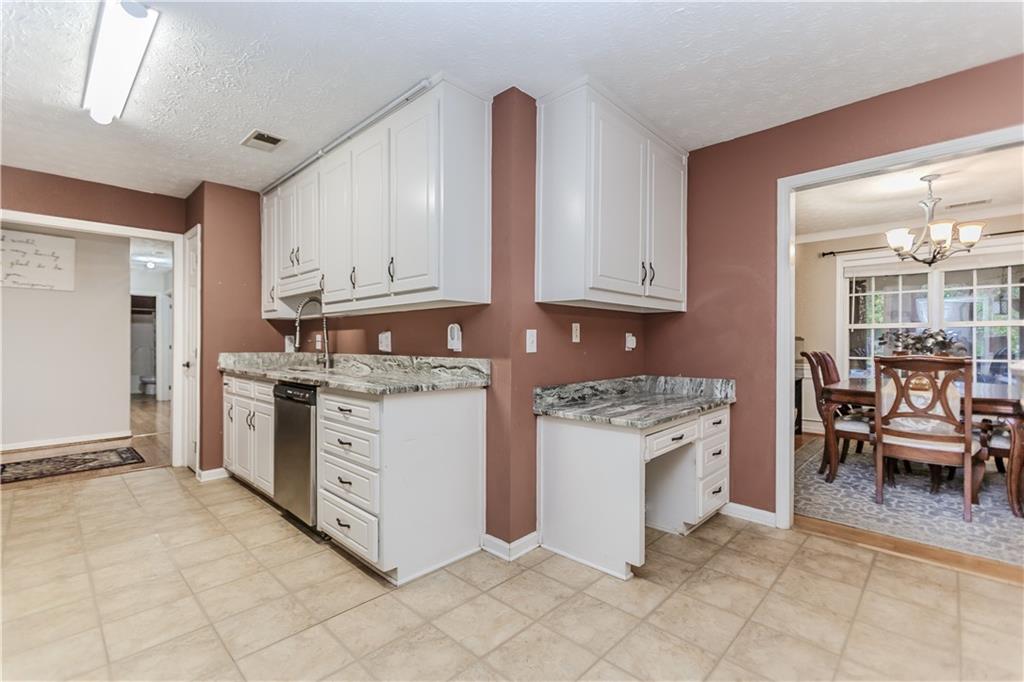 2790 Alcovy River View Dacula, GA 30019 - Photo 11 of 23 a kitchen with cabinets and chairs