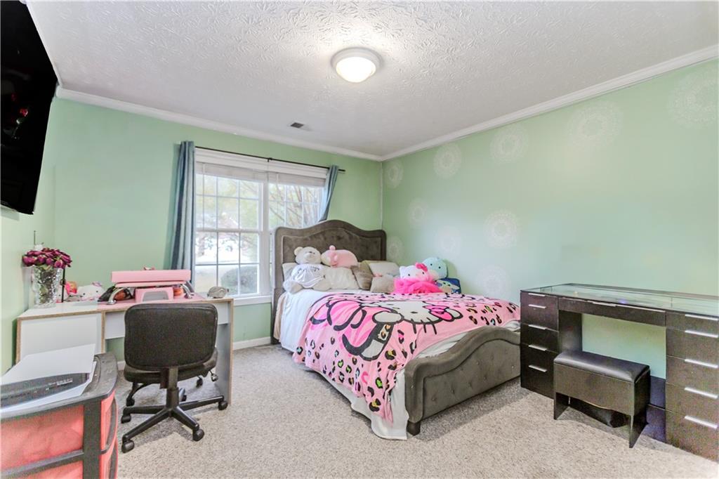 2790 Alcovy River View Dacula, GA 30019 - Photo 19 of 23 a bedroom with a bed and a window