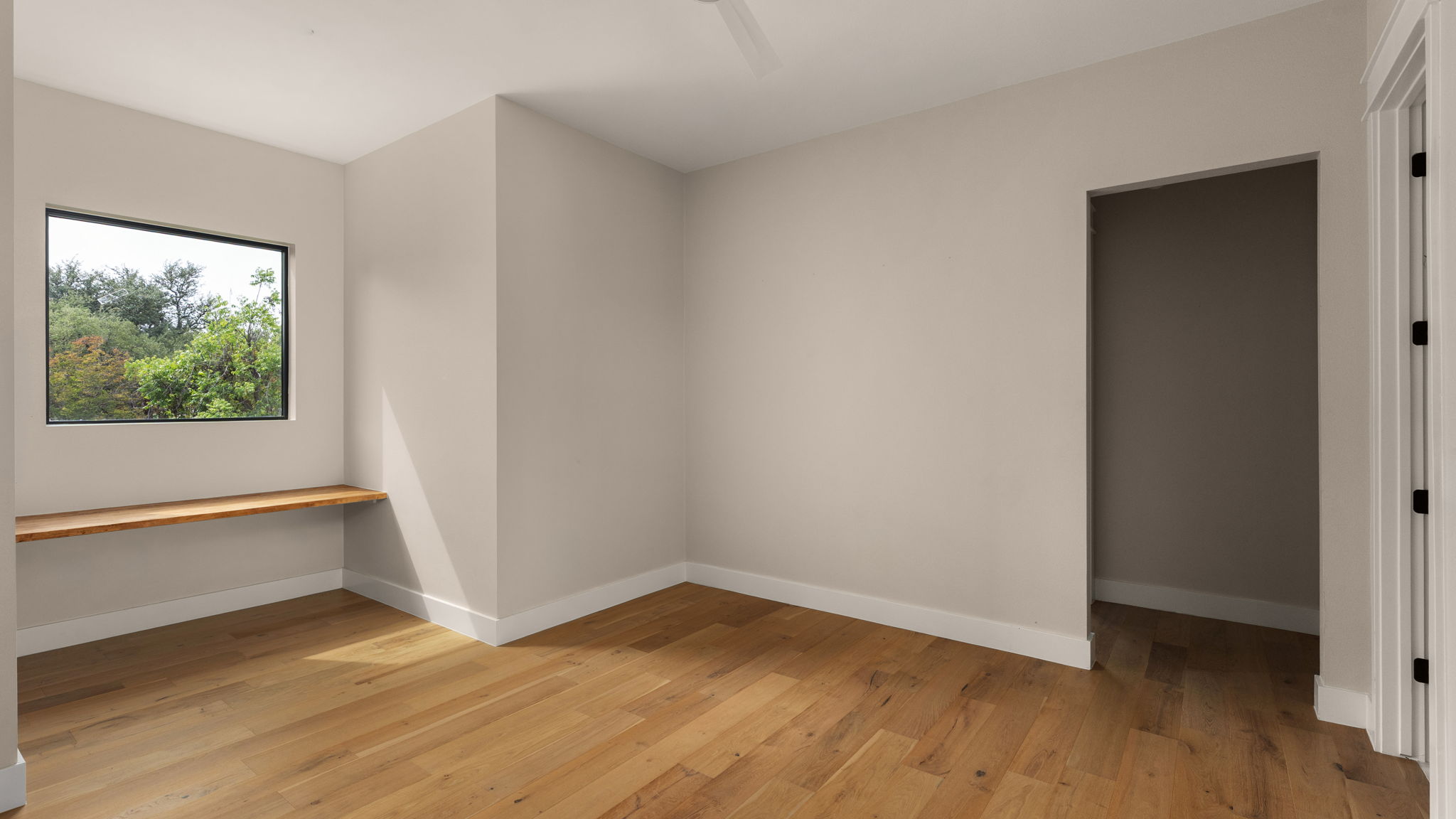 1909 West 40th Street Austin, TX 78731 - Photo 28 of 40 a view of an empty room with wooden floor and a window