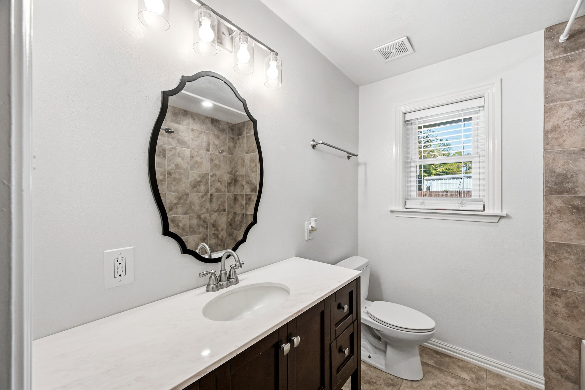 3602 Sweet Gum Spring, TX 77388 - Photo 21 of 30 a bathroom with a sink a toilet and a mirror