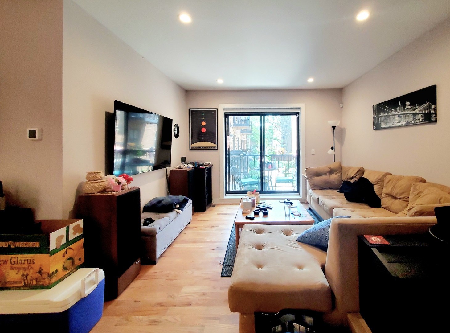 Undisclosed Address Chicago, IL 60657 - Photo 9 of 29 a living room with furniture and a flat screen tv