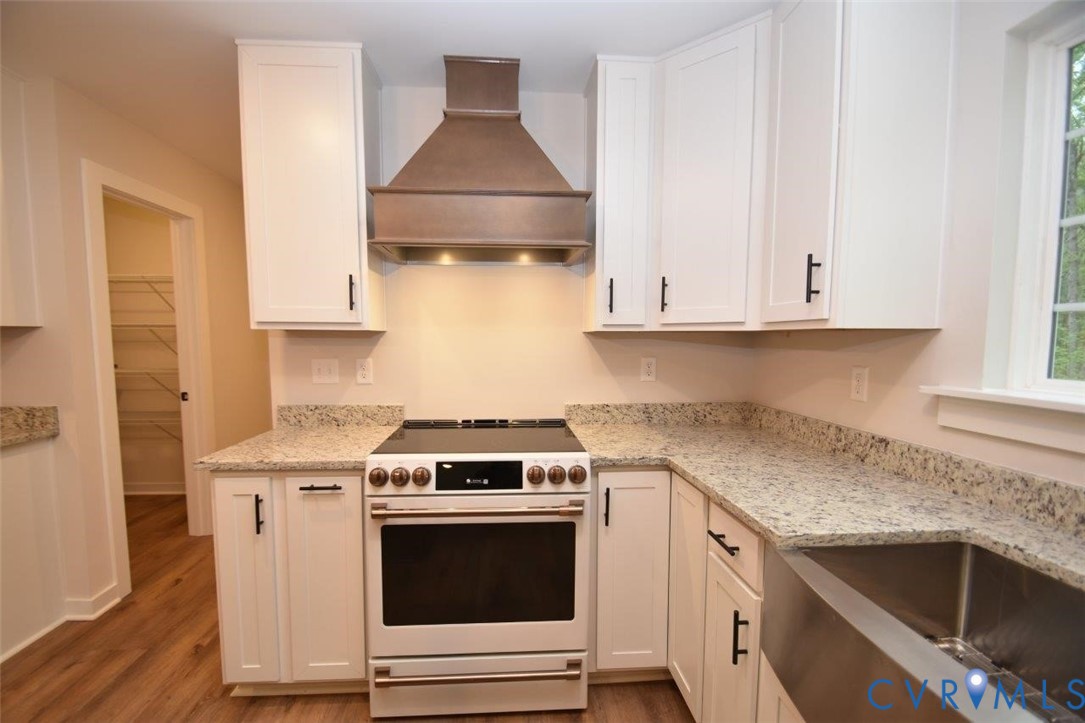 1749 Hollands Road Palmyra, VA 22963 - Photo 11 of 40 Kitchen with electric stove, white cabinets, premi
