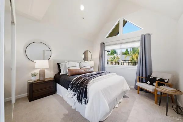 a bedroom with bed and a window