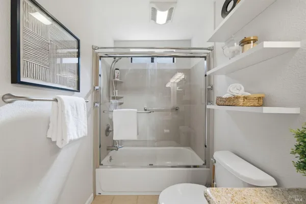 a bathroom with a tub and a shower