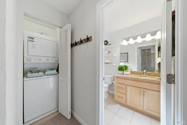 a bathroom with a double vanity sink and mirror