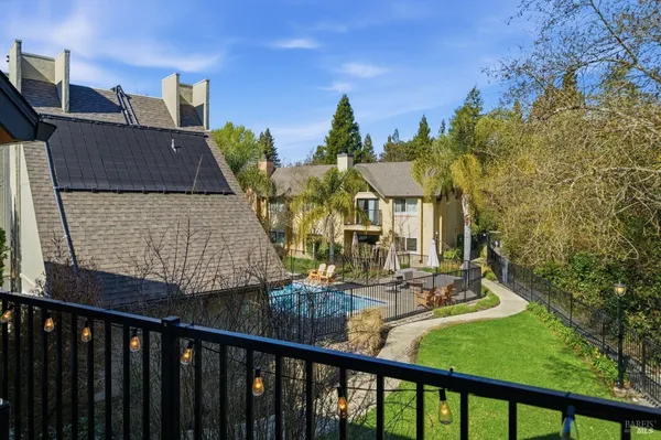 a view of a balcony with outdoor seating