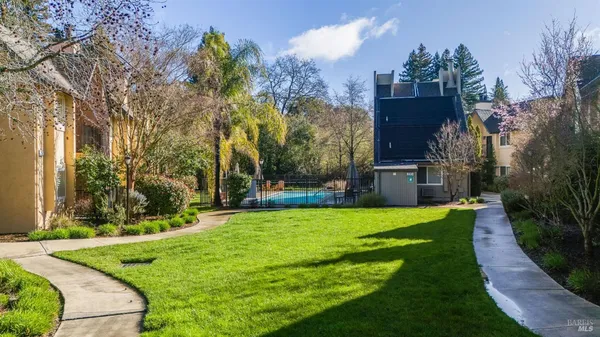 a view of a house with backyard