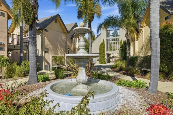 a view of a house with fountain and a fountain
