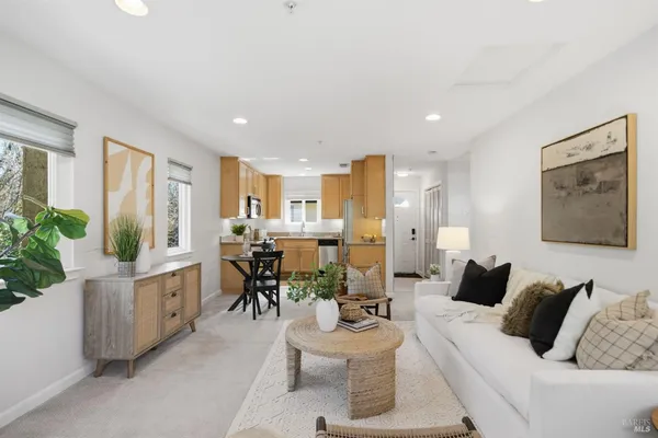 a living room with furniture and white walls