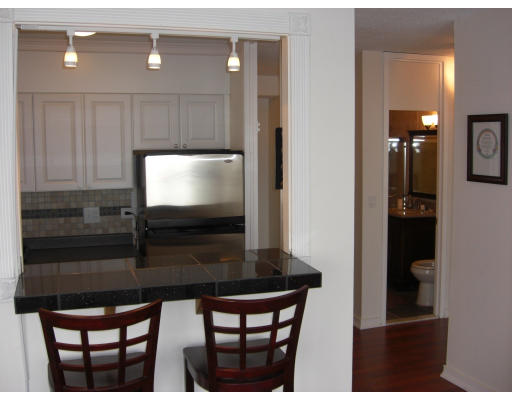 65 East India Row, Unit 16E Boston, MA 02110 - Photo 1 of 11 a kitchen with a table and chairs