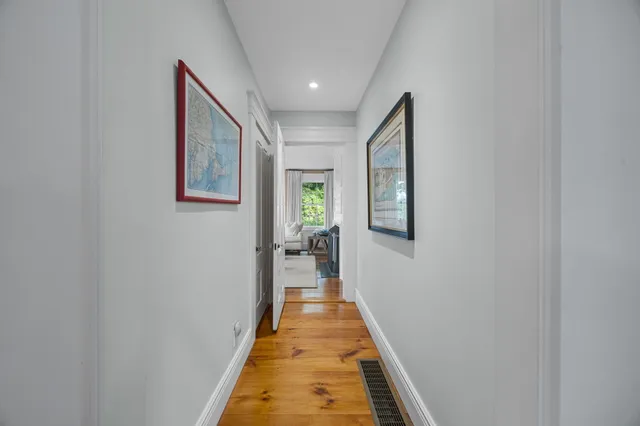 a kitchen with a stove a sink and a window
